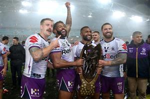 SYDNEY, AUSTRALIA - OCTOBER 25: Cameron Munster of the Storm, Josh Addo-Carr of the Storm, Justin Olam of the Storm and Kenneath Bromwich of the Storm pose with the Premiership trophy after winning the 2020 NRL Grand Final match between the Penrith Panthers and the Melbourne Storm at ANZ Stadium on October 25, 2020 in Sydney, Australia. (Photo by Cameron Spencer/Getty Images)