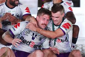 SYDNEY, AUSTRALIA - OCTOBER 25: Ryan Papenhuyzen of the Storm embraces Cameron Munster of the Storm after winning the 2020 NRL Grand Final match between the Penrith Panthers and the Melbourne Storm at ANZ Stadium on October 25, 2020 in Sydney, Australia. (Photo by Cameron Spencer/Getty Images)