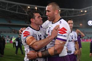 SYDNEY, AUSTRALIA - OCTOBER 25: Dale Finucane of the Storm and Nelson Asofa-Solomona of the Storm celebrate after winning the 2020 NRL Grand Final match between the Penrith Panthers and the Melbourne Storm at ANZ Stadium on October 25, 2020 in Sydney, Australia. (Photo by Cameron Spencer/Getty Images)