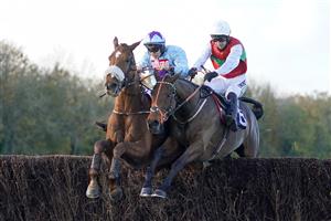 CHEPSTOW, WALES - OCTOBER 27: Adrian Heskin riding The Wolf (L, blue) clear the last to win The CD Racing At tipstersempire.co.uk Beginners' Chase at Chepstow Racecourse on October 27, 2020 in Chepstow, Wales. Owners are allowed to attend if they have a runner at the meeting otherwise racing remains behind closed doors to the public due to the Coronavirus pandemic. (Photo by Alan Crowhurst/Getty Images)