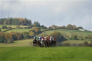 CHEPSTOW, WALES - OCTOBER 27: A general view as runners drop down the hill towards bend and the back straight at Chepstow Racecourse on October 27, 2020 in Chepstow, Wales. Owners are allowed to attend if they have a runner at the meeting otherwise racing remains behind closed doors to the public due to the Coronavirus pandemic. (Photo by Alan Crowhurst/Getty Images)