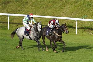 CHEPSTOW, WALES - OCTOBER 27: Charlie Price riding Spectator (maroon) clear the last to win The Wizard Of Big Odds At tipstersempire.co.uk Handicap Hurdle at Chepstow Racecourse on October 27, 2020 in Chepstow, Wales. Owners are allowed to attend if they have a runner at the meeting otherwise racing remains behind closed doors to the public due to the Coronavirus pandemic. (Photo by Alan Crowhurst/Getty Images)