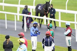 CHEPSTOW, WALES - OCTOBER 27: A general view as jockeys gather in the parade ring for the first race at Chepstow Racecourse on October 27, 2020 in Chepstow, Wales. Owners are allowed to attend if they have a runner at the meeting otherwise racing remains behind closed doors to the public due to the Coronavirus pandemic. (Photo by Alan Crowhurst/Getty Images)