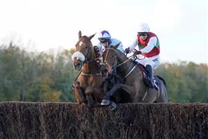 CHEPSTOW, WALES - OCTOBER 27: Adrian Heskin riding The Wolf (L, blue) clear the last to win The CD Racing At tipstersempire.co.uk Beginners' Chase at Chepstow Racecourse on October 27, 2020 in Chepstow, Wales. Owners are allowed to attend if they have a runner at the meeting otherwise racing remains behind closed doors to the public due to the Coronavirus pandemic. (Photo by Alan Crowhurst/Getty Images)