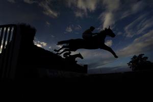 TAUNTON, ENGLAND - OCTOBER 28: A general view as runners clear a fence during The Newton King Estate Agents Handicap Chase at Taunton Racecourse on October 28, 2020 in Taunton, England. Owners are allowed to attend if they have a runner at the meeting otherwise racing remains behind closed doors to the public due to the Coronavirus pandemic. (Photo by Alan Crowhurst/Getty Images) (Photo by Alan Crowhurst/Getty Images)