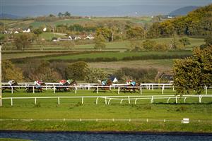 TAUNTON, ENGLAND - OCTOBER 28: A general view of action during The Invest Southwest Handicap Hurdle at Taunton Racecourse on October 28, 2020 in Taunton, England. Owners are allowed to attend if they have a runner at the meeting otherwise racing remains behind closed doors to the public due to the Coronavirus pandemic. (Photo by Alan Crowhurst/Getty Images)