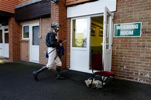 TAUNTON, ENGLAND - OCTOBER 28: Jockeys return to the weighing room after the first race at Taunton Racecourse on October 28, 2020 in Taunton, England. Owners are allowed to attend if they have a runner at the meeting otherwise racing remains behind closed doors to the public due to the Coronavirus pandemic. (Photo by Alan Crowhurst/Getty Images)