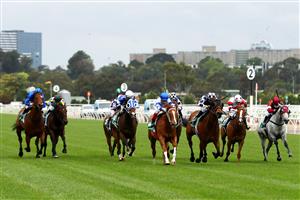 MELBOURNE, AUSTRALIA - OCTOBER 31: Craig Williams riding #4 Kemalpasa (centre, blue cap) leads the field to go on and win race three the Tab Stakes during 2020 AAMI Victoria Derby Day at Flemington Racecourse on October 31, 2020 in Melbourne, Australia. (Photo by Robert Cianflone/Getty Images for the VRC)