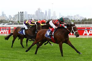 MELBOURNE, AUSTRALIA - OCTOBER 31: Craig Williams riding #12 September Run wins race six the Coolmore Stud Stakes during 2020 AAMI Victoria Derby Day at Flemington Racecourse on October 31, 2020 in Melbourne, Australia. (Photo by Robert Cianflone/Getty Images for the VRC)