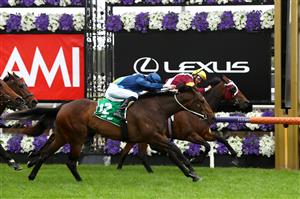 MELBOURNE, AUSTRALIA - OCTOBER 31: Damien Oliver riding #6 Shout The Bar wins race five the Tab Empire Rose Stakes from Jye McNeil riding #12 Odeum during 2020 AAMI Victoria Derby Day at Flemington Racecourse on October 31, 2020 in Melbourne, Australia. (Photo by Robert Cianflone/Getty Images for the VRC)