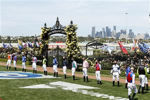 MELBOURNE, AUSTRALIA - NOVEMBER 03: Jockeys line up for the national anthem before race 7 the Lexus Melbourne Cupduring 2020 Lexus Melbourne Cup Day at Flemington Racecourse on November 03, 2020 in Melbourne, Australia. (Photo by Darrian Traynor/Getty Images for the VRC)