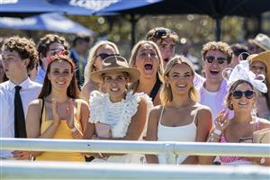 SYDNEY, AUSTRALIA - NOVEMBER 03: Racegoers cheer as they watch the Melbourne Cup on the big screen during Bentley Cup Day at Royal Randwick Racecourse on November 03, 2020 in Sydney, Australia. The Melbourne Cup is Australia