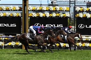 MELBOURNE, AUSTRALIA - NOVEMBER 03: Jye McNeil riding #6 Twilight Payment wins race 7, the Lexus Melbourne Cup ahead of Kerrin Mcevoy riding #21 Tiger Moth and Jamie Kah riding #12 Prince Of Arran during 2020 Lexus Melbourne Cup Day at Flemington Racecourse on November 03, 2020 in Melbourne, Australia. (Photo by Robert Cianflone/Getty Images for the VRC)