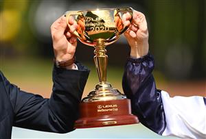 MELBOURNE, AUSTRALIA - NOVEMBER 03: Mark Power, the travelling foreman and jockey Jye McNeil who rode Twilight Payment celebrates with the trophy after winning the Lexus melbourne Cup during 2020 Lexus Melbourne Cup Day at Flemington Racecourse on November 03, 2020 in Melbourne, Australia. (Photo by Quinn Rooney/Getty Images for the VRC)