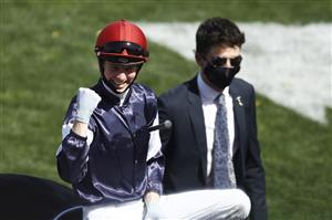 MELBOURNE, AUSTRALIA - NOVEMBER 03: Jockey Jye McNeil celebrates after riding Twilight Payment to win Race 7, the Lexus Melbourne Cup, during 2020 Lexus Melbourne Cup Day at Flemington Racecourse on November 03, 2020 in Melbourne, Australia. (Photo by Daniel Pockett/Getty Images for the VRC)