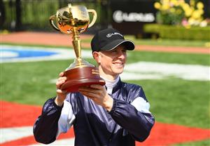 MELBOURNE, AUSTRALIA - NOVEMBER 03: Jye McNeil who rode Twilight Payment celebrates with the trophy after winning the Lexus melbourne Cup during 2020 Lexus Melbourne Cup Day at Flemington Racecourse on November 03, 2020 in Melbourne, Australia. (Photo by Quinn Rooney/Getty Images for the VRC)