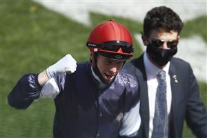 MELBOURNE, AUSTRALIA - NOVEMBER 03: Jockey Jye McNeil celebrates after riding Twilight Payment to win Race 7, the Lexus Melbourne Cup, during 2020 Lexus Melbourne Cup Day at Flemington Racecourse on November 03, 2020 in Melbourne, Australia. (Photo by Daniel Pockett/Getty Images for the VRC)