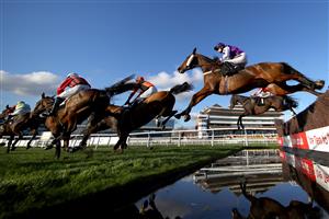 NEWBURY, ENGLAND - NOVEMBER 05: Adrian Heskin riding Azzerti jumps a fence during the Indzine Handicap Chase at Newbury Racecourse on November 05, 2020 in Newbury, England. (Photo by Michael Steele/Getty Images)