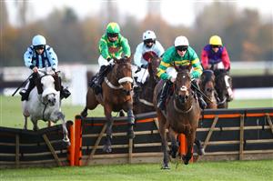 NEWBURY, ENGLAND - NOVEMBER 05: Lorcan Williams riding Tomorrow Mystery goes over the final jump on their way to winning the tote.co.uk Ten To Follow Conditional Jockeys' Handicap Hurdle at Newbury Racecourse on November 05, 2020 in Newbury, England. (Photo by Michael Steele/Getty Images)