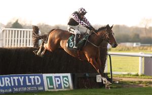 WARWICK, ENGLAND - NOVEMBER 06: Defuture Is Bright ridden by Jack Tudor jumps a fence before winning the Join Racing TV Now Conditional Jockeys' Handicap Chase at Warwick Racecourse on November 6, 2020 in Warwick, England. (Photo by David Davies - Pool / Getty Images)