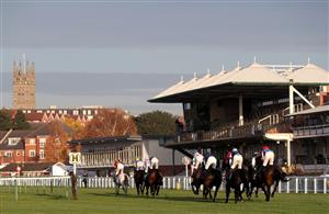 WARWICK, ENGLAND - NOVEMBER 06: Runners and riders pass the grand stand as they compete in the British EBF Mares' Standard Open NH Flat Race at Warwick Racecourse on November 6, 2020 in Warwick, England. (Photo by David Davies - Pool / Getty Images)