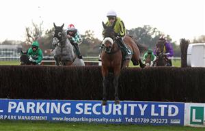 WARWICK, ENGLAND - NOVEMBER 06: Allmankind ridden by Harry Skelton jumps a fence before winning the Stan Mellor Memorial Novices Chase at Warwick Racecourse on November 6, 2020 in Warwick, England. (Photo by David Davies - Pool / Getty Images)