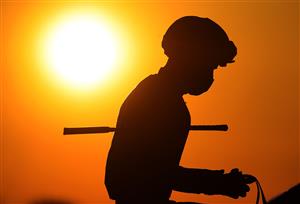 LEXINGTON, KENTUCKY - NOVEMBER 06: The sun sets on the jockeys before the start of the Breeder's Cup Juvenile during the 2020 Breeder's Cup at Keeneland on November 06, 2020 in Lexington, Kentucky. (Photo by Andy Lyons/Getty Images)