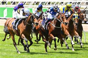 MELBOURNE, AUSTRALIA - NOVEMBER 07: Declan Bates riding Barade wins the VERY Special Kids Pin and Win Trophy during 2020 Seppelt Wines Stakes Day at Flemington Racecourse on November 07, 2020 in Melbourne, Australia. (Photo by Quinn Rooney/Getty Images for the VRC)
