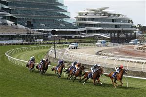 MELBOURNE, AUSTRALIA - NOVEMBER 07: The field run around the bend during race 5, the Queen Elizabeth Stakes during 2020 Seppelt Wines Stakes Day at Flemington Racecourse on November 07, 2020 in Melbourne, Australia. (Photo by Daniel Pockett/Getty Images for the VRC)