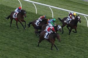 MELBOURNE, AUSTRALIA - NOVEMBER 07: Luke Currie riding #9 Arcadia Queen wins race 8, the Seppelt Mackinnon Stakes during 2020 Seppelt Wines Stakes Day at Flemington Racecourse on November 07, 2020 in Melbourne, Australia. (Photo by Daniel Pockett/Getty Images for the VRC)