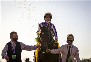 LEXINGTON, KY - NOVEMBER 07: Christophe Soumillon, riding Order of Australia, celebrates after winning the Breeders Cup Mile at Keenland on November 6, 2020 in Lexington, Kentucky. (Photo by Bobby Ellis/Getty Images)