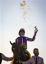 LEXINGTON, KY - NOVEMBER 07: Christophe Soumillon, riding Order of Australia, celebrates after winning the Breeders Cup Mile at Keenland on November 6, 2020 in Lexington, Kentucky. (Photo by Bobby Ellis/Getty Images)