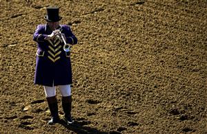 LEXINGTON, KY - NOVEMBER 07: The bugler gives the call for riders to mount their horses during the second day of the Breeders Cup at Keenland on November 7, 2020 in Lexington, Kentucky. (Photo by Bobby Ellis/Getty Images)
