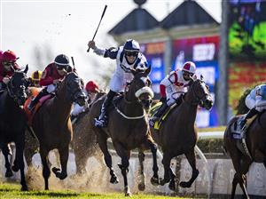 LEXINGTON, KY - NOVEMBER 07: Tom Eaves, riding Glass Slippers, celebrates as he crosses the finish line to win the Turf Sprint on the second day of the Breeders Cup at Keenland on November 6, 2020 in Lexington, Kentucky. (Photo by Bobby Ellis/Getty Images)