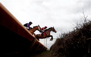BANGOR, WALES - NOVEMBER 11: The Two Amigos ridden by Matt Griffiths (right) takes a jump in The Anne Duchess Of Westminster Memorial Handicap Chase at Bangor-on-Dee Racecourse on November 11, 2020 in Bangor, United Kingdom. (Photo by David Davies - Pool/Getty Images)
