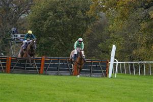 TAUNTON, ENGLAND - NOVEMBER 12: Alexander Thorne riding Twin Star (pink/green) clear the last to win The Invest Southwest Handicap Hurdle, the jockey failed to weigh in after the race and was disqualified by the Clerk of the Scales making Jordan Nailor riding Robinshill (yellow cap) the winner at Taunton Racecourse on November 12, 2020 in Taunton, England. Owners are allowed to attend if they have a runner at the meeting otherwise racing remains behind closed doors to the public due to the Coronavirus pandemic. (Photo by Alan Crowhurst/Getty Images)