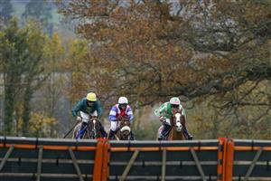 TAUNTON, ENGLAND - NOVEMBER 12: Alexander Thorne riding Twin Star (pink/green) clear the last to win The Invest Southwest Handicap Hurdle at Taunton Racecourse on November 12, 2020 in Taunton, England. Owners are allowed to attend if they have a runner at the meeting otherwise racing remains behind closed doors to the public due to the Coronavirus pandemic. (Photo by Alan Crowhurst/Getty Images)
