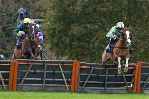 TAUNTON, ENGLAND - NOVEMBER 12: Alexander Thorne riding Twin Star (pink/green) clear the last to win The Invest Southwest Handicap Hurdle at Taunton Racecourse on November 12, 2020 in Taunton, England. Owners are allowed to attend if they have a runner at the meeting otherwise racing remains behind closed doors to the public due to the Coronavirus pandemic. (Photo by Alan Crowhurst/Getty Images)