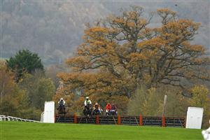 TAUNTON, ENGLAND - NOVEMBER 12: Harry Cobden riding Atholl Street (white cap) clear the last to win The Stables Business Park Maiden Hurdle at Taunton Racecourse on November 12, 2020 in Taunton, England. Owners are allowed to attend if they have a runner at the meeting otherwise racing remains behind closed doors to the public due to the Coronavirus pandemic. (Photo by Alan Crowhurst/Getty Images)