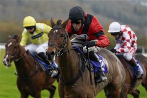 TAUNTON, ENGLAND - NOVEMBER 12: Harry Skelton riding Aggy With It (red) clear the last to win The Newton King Estate Agents Novices' Hurdle at Taunton Racecourse on November 12, 2020 in Taunton, England. Owners are allowed to attend if they have a runner at the meeting otherwise racing remains behind closed doors to the public due to the Coronavirus pandemic. (Photo by Alan Crowhurst/Getty Images)