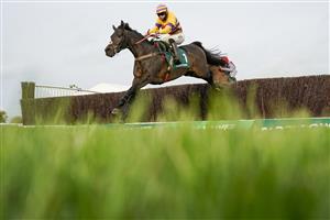 CHELTENHAM, ENGLAND - NOVEMBER 13: Bryan Carver riding Magic Saint clear the last to win The Mucking Brilliant Paddy Power Handicap Chase at Cheltenham Racecourse on November 13, 2020 in Cheltenham, England. Owners are allowed to attend if they have a runner at the meeting otherwise racing remains behind closed doors to the public due to the Coronavirus pandemic. (Photo by Alan Crowhurst/Getty Images)