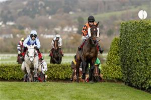 CHELTENHAM, ENGLAND - NOVEMBER 13: Tom Scudamore riding Kingswell Theatre (orange) clear the 'Cheese Wedges' on their way to winning The Glenfarclas Cross Country Handicap Chase at Cheltenham Racecourse on November 13, 2020 in Cheltenham, England. Owners are allowed to attend if they have a runner at the meeting otherwise racing remains behind closed doors to the public due to the Coronavirus pandemic. (Photo by Alan Crowhurst/Getty Images)