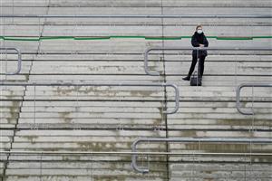 CHELTENHAM, ENGLAND - NOVEMBER 14: Standing alone on the steps of the grandstand to watch the first race of the day at Cheltenham Racecourse on November 14, 2020 in Cheltenham, England. Owners are allowed to attend if they have a runner at the meeting otherwise racing remains behind closed doors to the public due to the Coronavirus pandemic. (Photo by Alan Crowhurst/Getty Images)