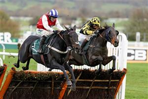 CHELTENHAM, ENGLAND - NOVEMBER 14: Nico de Boinville riding On The Blind Side (red) clear the last to win The Paddy Power Games Handicap Hurdle at Cheltenham Racecourse on November 14, 2020 in Cheltenham, England. Owners are allowed to attend if they have a runner at the meeting otherwise racing remains behind closed doors to the public due to the Coronavirus pandemic. (Photo by Alan Crowhurst/Getty Images)