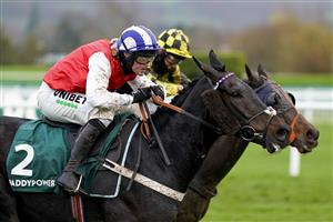 CHELTENHAM, ENGLAND - NOVEMBER 14: Nico de Boinville riding On The Blind Side (red) clear the last to win The Paddy Power Games Handicap Hurdle at Cheltenham Racecourse on November 14, 2020 in Cheltenham, England. Owners are allowed to attend if they have a runner at the meeting otherwise racing remains behind closed doors to the public due to the Coronavirus pandemic. (Photo by Alan Crowhurst/Getty Images)