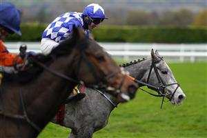 CHELTENHAM, ENGLAND - NOVEMBER 14: Robbie Power riding Duffle Coat (blue) clear the last to win The JCB Triumph Trial Juvenile Hurdle at Cheltenham Racecourse on November 14, 2020 in Cheltenham, England. Owners are allowed to attend if they have a runner at the meeting otherwise racing remains behind closed doors to the public due to the Coronavirus pandemic. (Photo by Alan Crowhurst/Getty Images)
