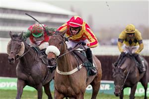 CHELTENHAM, ENGLAND - NOVEMBER 14: Tom O'Brien riding Coole Cody (red/yellow) clear the last to win The Paddy Power Gold Cup Handicap Chase at Cheltenham Racecourse on November 14, 2020 in Cheltenham, England. Owners are allowed to attend if they have a runner at the meeting otherwise racing remains behind closed doors to the public due to the Coronavirus pandemic. (Photo by Alan Crowhurst/Getty Images)