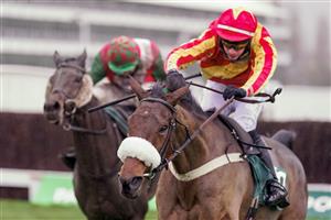 CHELTENHAM, ENGLAND - NOVEMBER 14: Tom O'Brien riding Coole Cody (red/yellow) clear the last to win The Paddy Power Gold Cup Handicap Chase at Cheltenham Racecourse on November 14, 2020 in Cheltenham, England. Owners are allowed to attend if they have a runner at the meeting otherwise racing remains behind closed doors to the public due to the Coronavirus pandemic. (Photo by Alan Crowhurst/Getty Images)