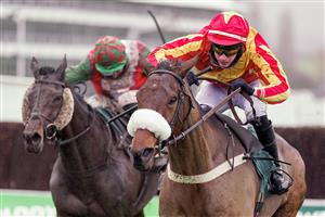 CHELTENHAM, ENGLAND - NOVEMBER 14: Tom O'Brien riding Coole Cody (red/yellow) clear the last to win The Paddy Power Gold Cup Handicap Chase at Cheltenham Racecourse on November 14, 2020 in Cheltenham, England. Owners are allowed to attend if they have a runner at the meeting otherwise racing remains behind closed doors to the public due to the Coronavirus pandemic. (Photo by Alan Crowhurst/Getty Images)