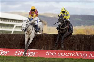 CHELTENHAM, ENGLAND - NOVEMBER 15: Tom Scudamore riding Ramses de Teillee (L) clear the last to win The Planteur At Chapel Stud Handicap Chase from Bryony Frost and Yala Enki (R) at Cheltenham Racecourse on November 15, 2020 in Cheltenham, England. Owners are allowed to attend if they have a runner at the meeting otherwise racing remains behind closed doors to the public due to the Coronavirus pandemic. (Photo by Alan Crowhurst/Getty Images)